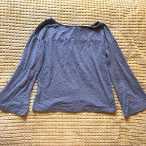 women’s grey long sleeve blouse with belled sleeves and buttons down back